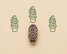 Prickly pear cactus stamp making green repeating pattern on handmade paper