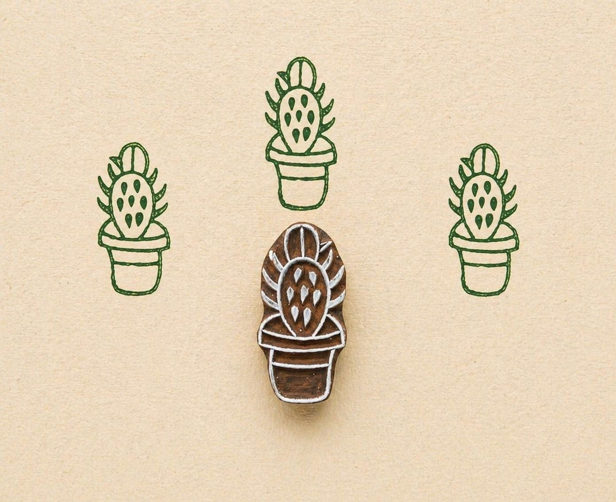 Prickly pear cactus stamp making green repeating pattern on handmade paper