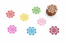 Hand carved wooden stamp with looped petal flower design