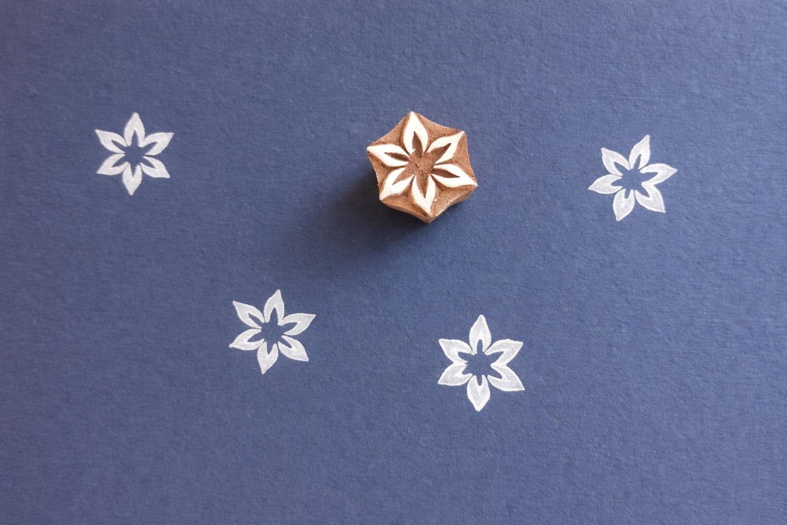 Hand carved wooden stamp with star shaped flower design