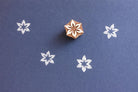 Hand carved wooden stamp with star shaped flower design