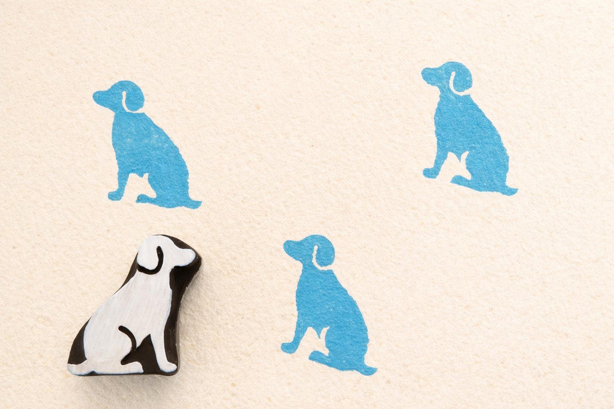 Dog wooden printing stamp used on fabric showing blue textile prints block printing stamp for fabric crafts