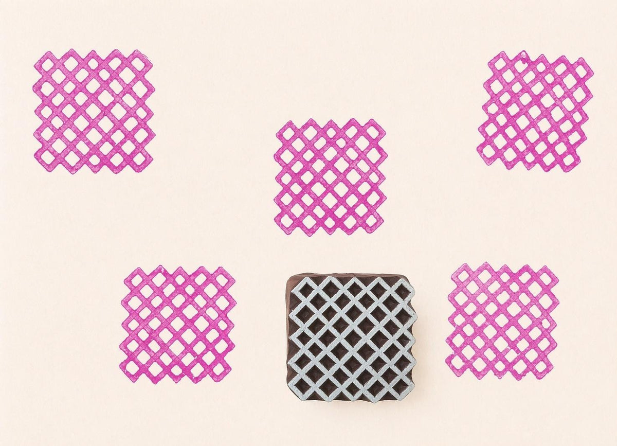 Wooden lattice pattern stamp with pink ink repeated print design on neutral background