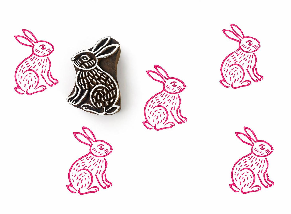 Meadow Hare wood block stamp with pink ink prints on white background