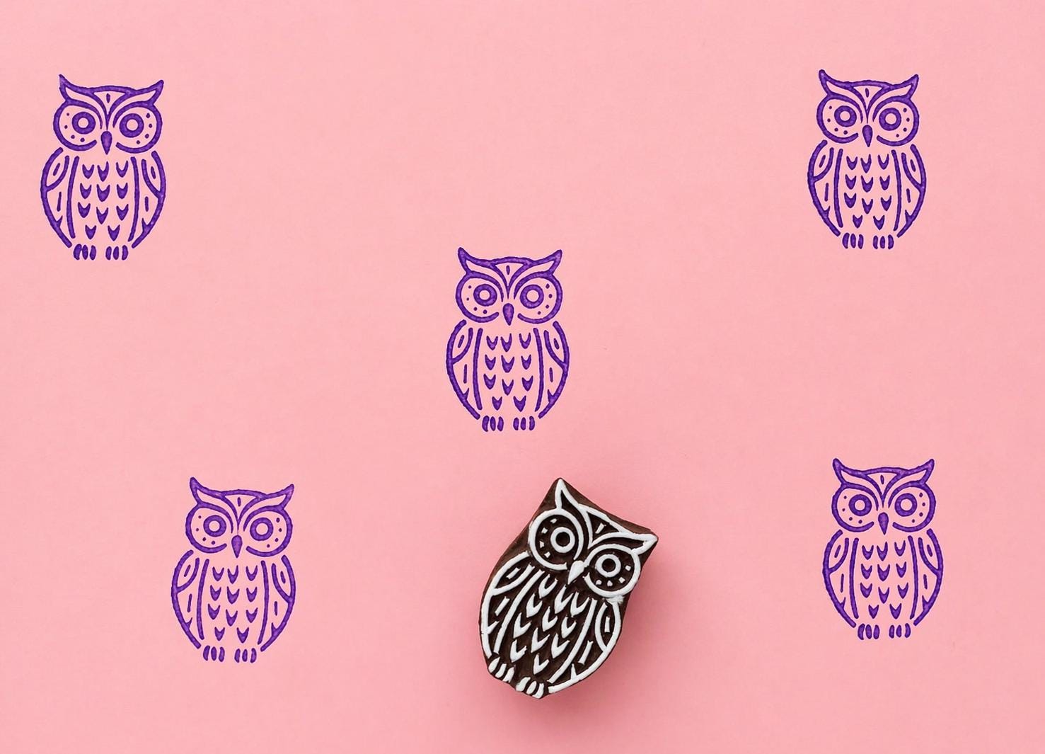 Moonwatch Owl wood block stamp with purple ink prints on pink background