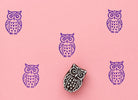 Moonwatch Owl wood block stamp with purple ink prints on pink background