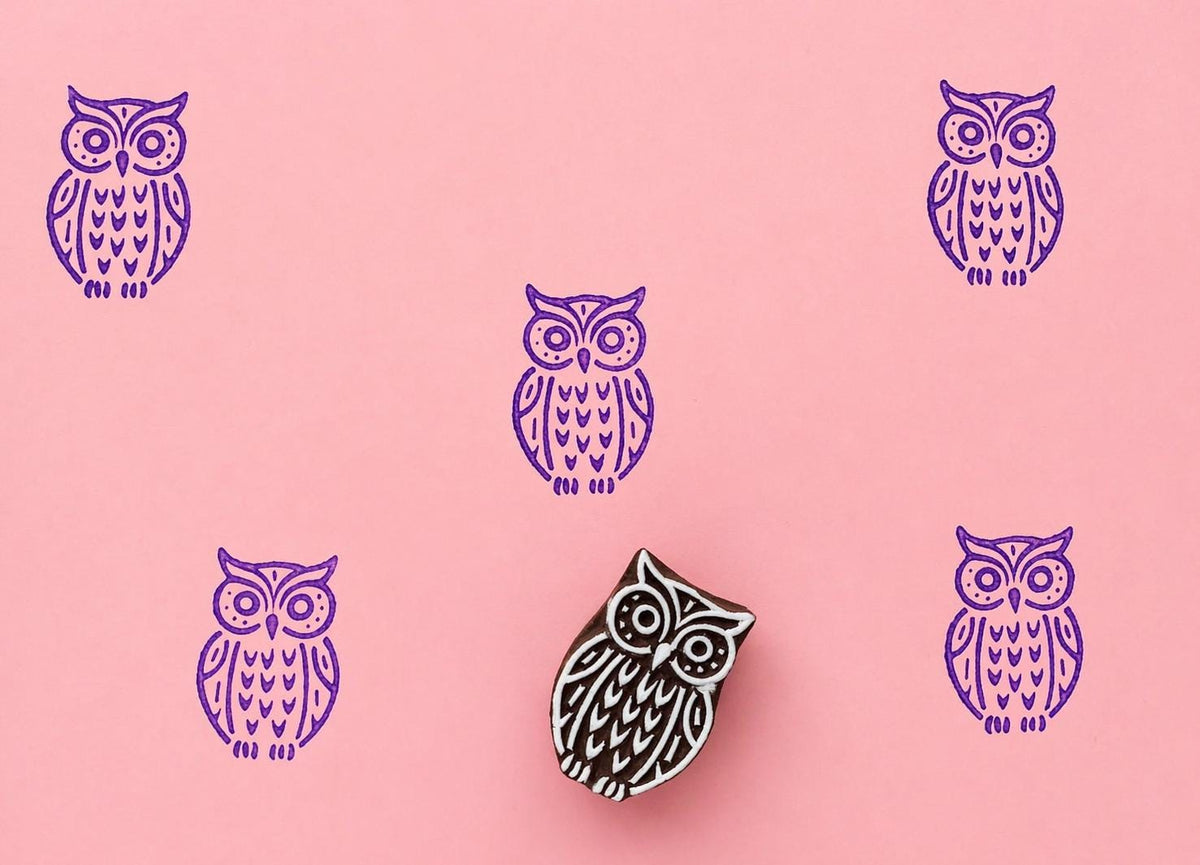 Moonwatch Owl wood block stamp with purple ink prints on pink background