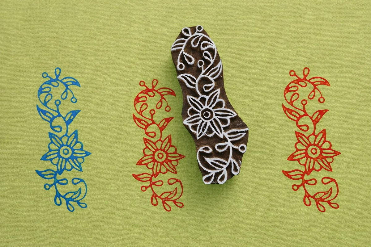 Hand carved wooden block printing stamp with floral vine border design for fabric printing
