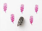 Hand carved wooden printing block with a decorative posy bloom motif for botanical textile printing and handmade surface pattern crafts.