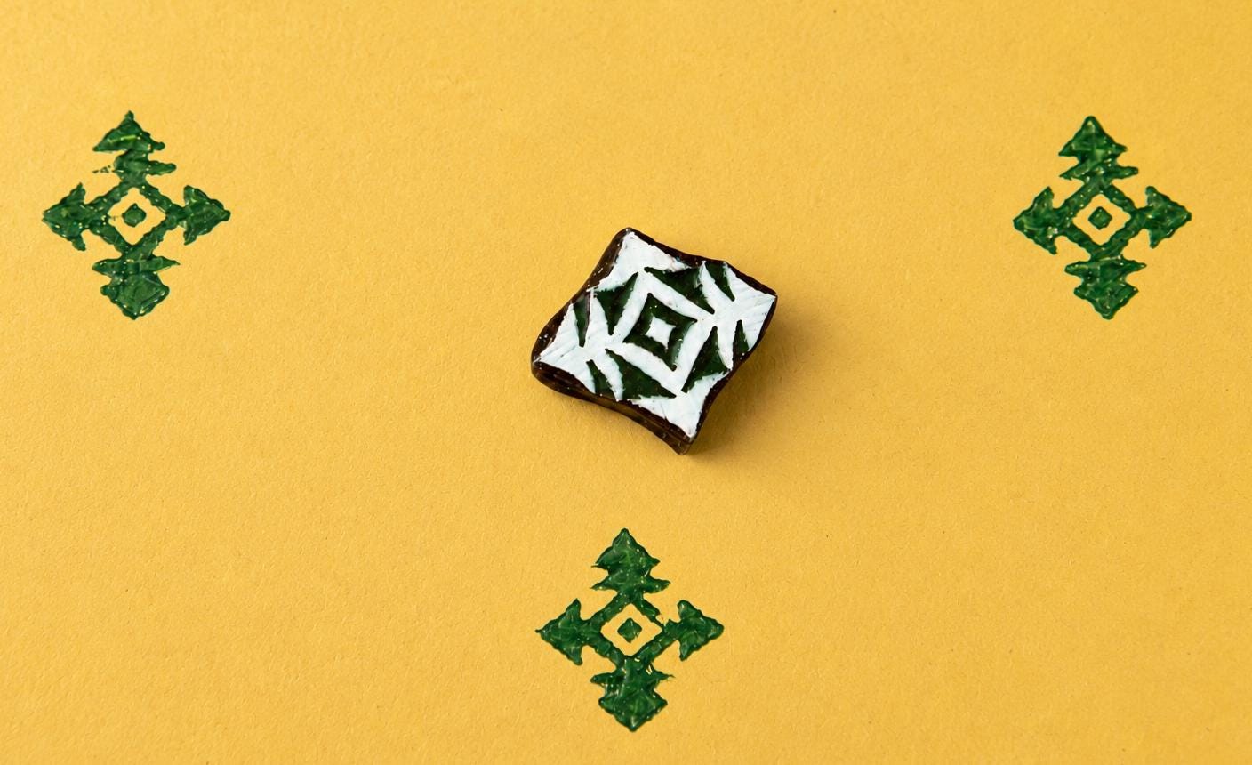 Hand carved wooden printing block with a prairie diamond geometric motif for textile printing, tribal-inspired crafts, and repeat surface patterns.