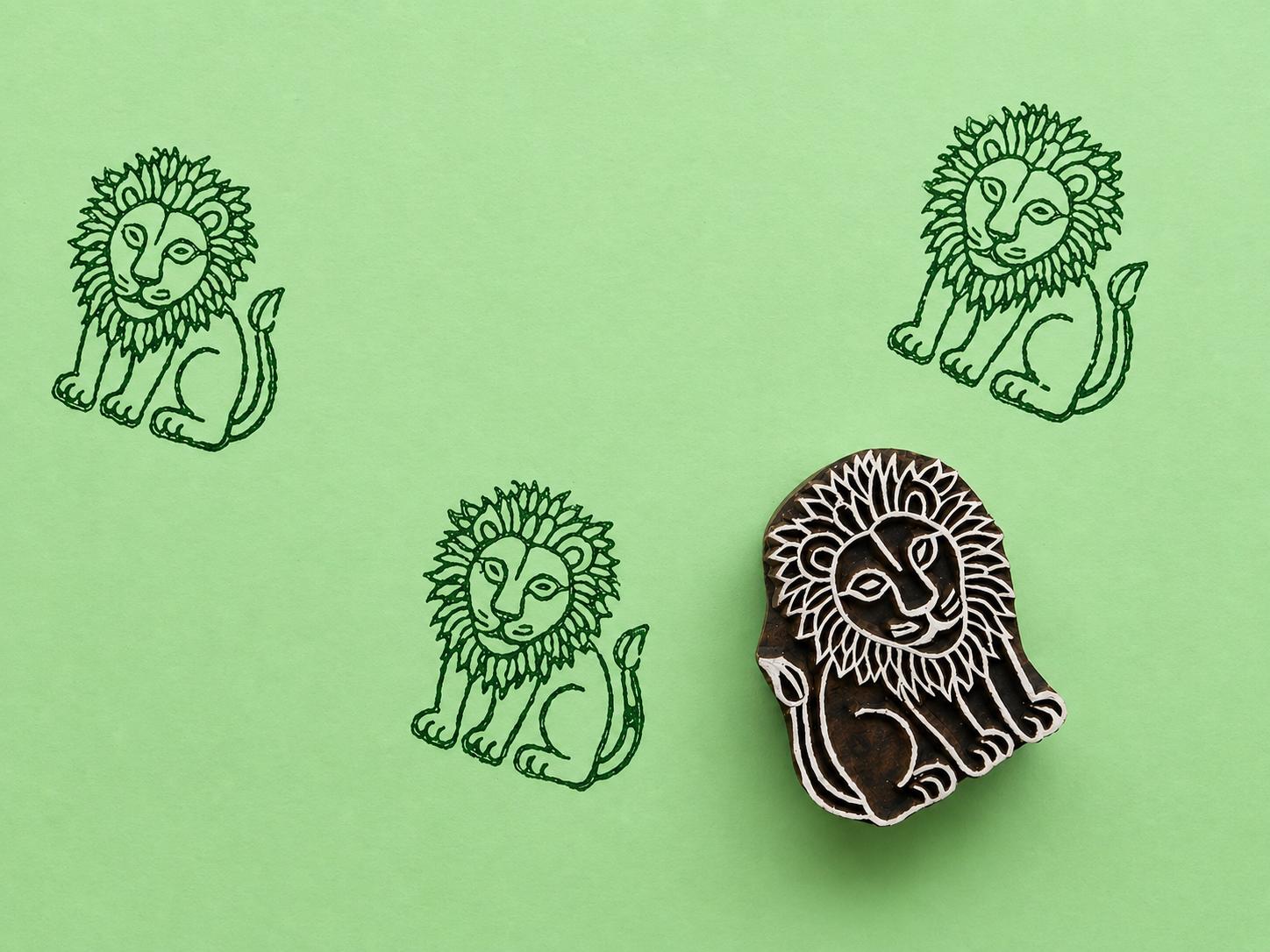 Hand carved wooden lion stamp printing folk art lion design in dark green ink