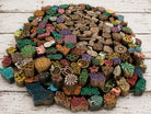 Large collection of wooden printing blocks showing hundreds of hand carved animal, floral, geometric and decorative stamp designs.