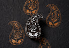 Hand carved Bloomvine Paisley block stamp with repeating folk floral paisley impressions printed on handmade paper