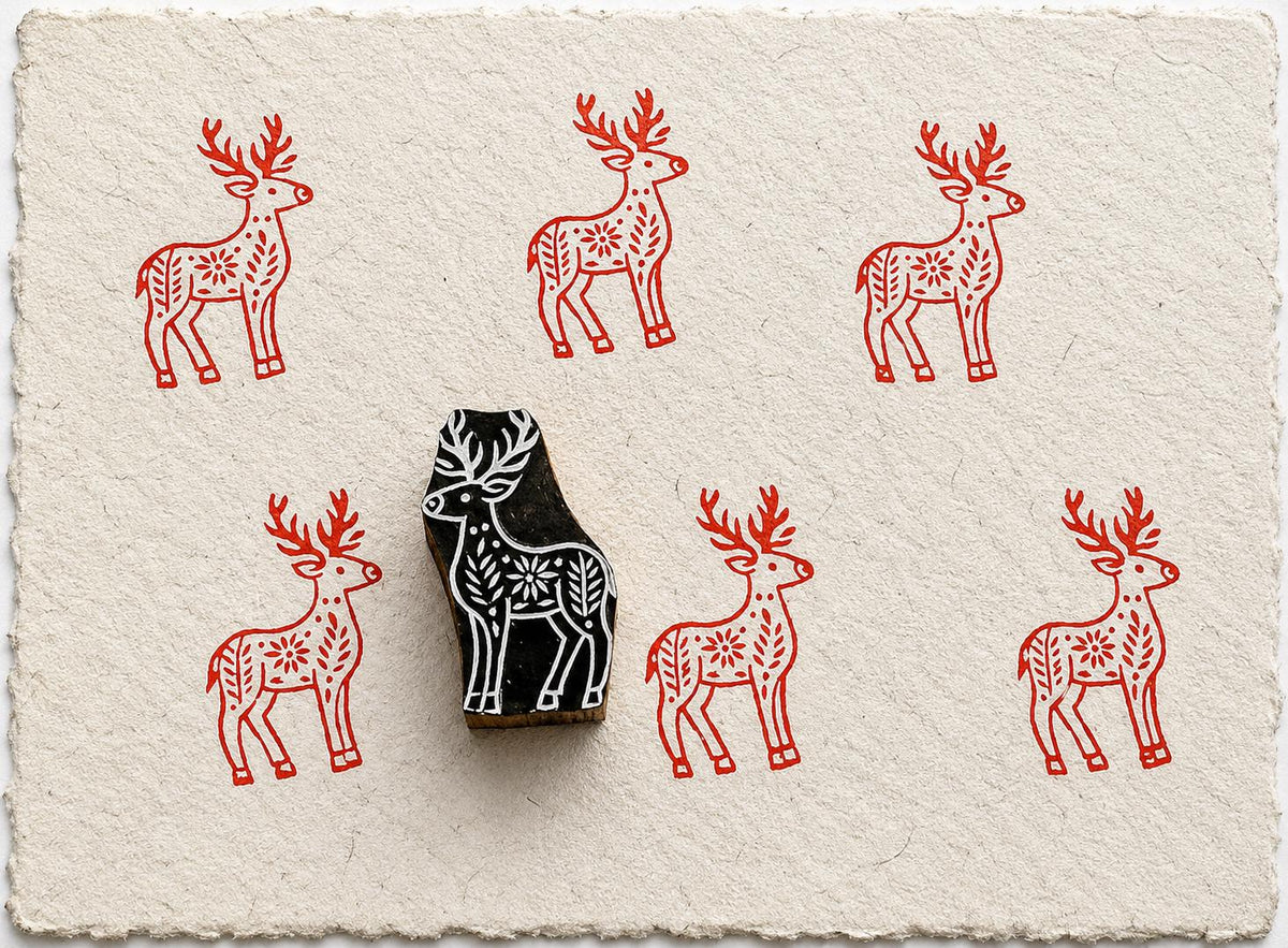 Hand carved decorative deer block stamp with repeating folk-inspired print pattern