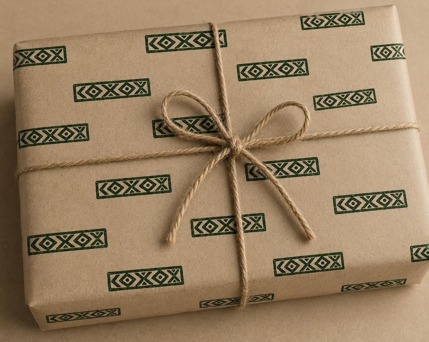 Hand carved wooden border printing block impressions on kraft paper box which is gift wrapped