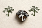 Hand carved folk blossom tree wood block stamp with repeating floral tree impressions on handmade paper