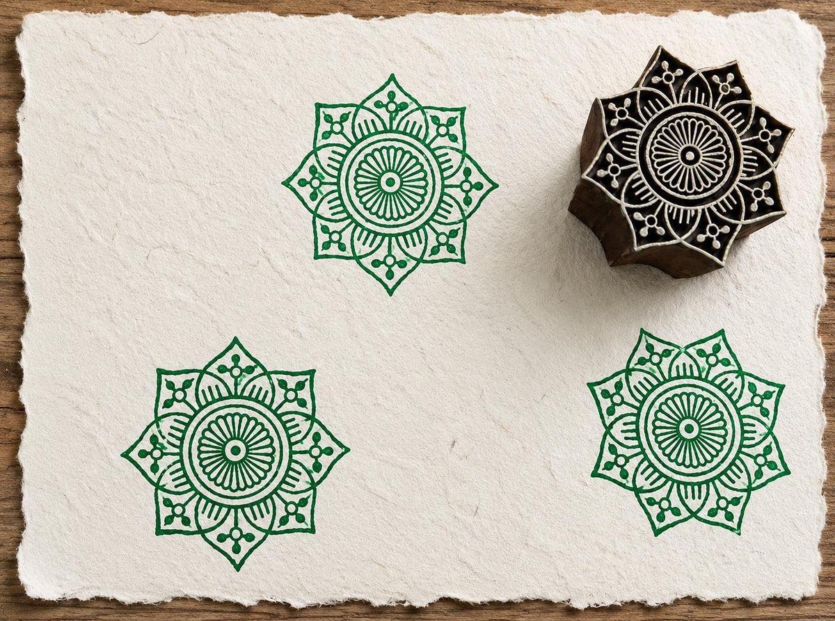 Hand carved Heritage Star Mandala wood block stamp with green geometric mandala impressions on handmade paper