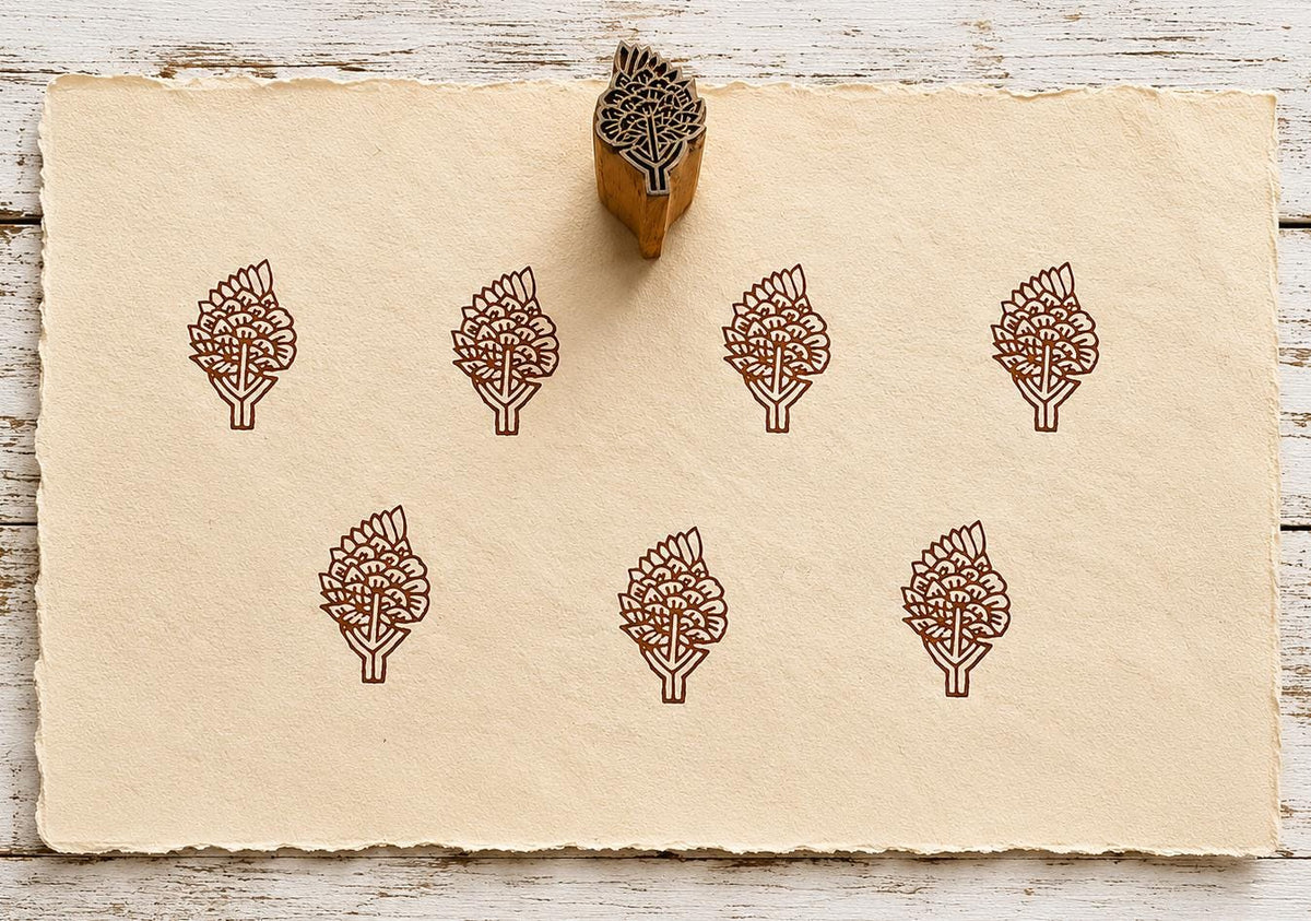 Hand carved Blooming Branch wooden block stamp with repeating brown botanical impressions on handmade paper.