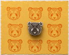 Hand carved Floral Panda wooden printing block displayed with orange panda impressions on handmade yellow paper.