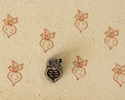 Hand carved Rustic Beet wooden printing block with burnt orange beet impressions on handmade ivory paper.