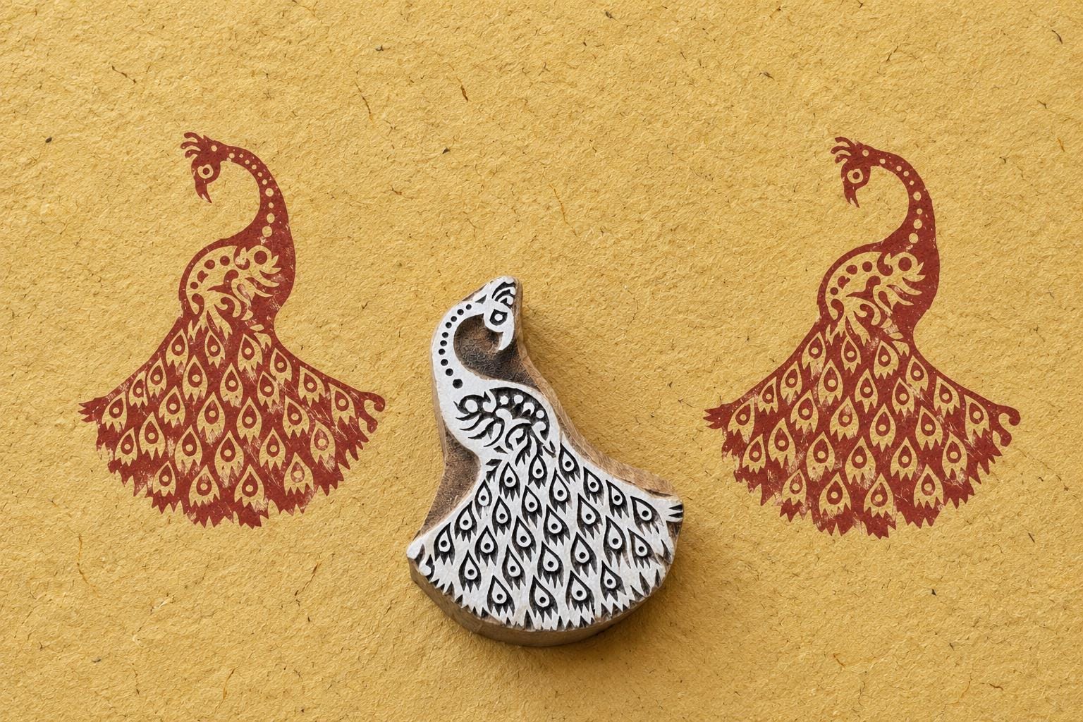 Peacock Feather Block wooden stamp with detailed feather pattern printed in red