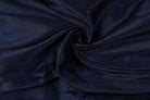 Close-up of midnight navy poly dupioni fabric showing its finely textured surface and subtle faux silk sheen.