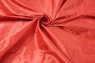 Rich vermilion red faux dupioni fabric showing its subtle textured sheen