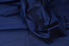 Royal blue faux dupioni fabric showing its textured woven surface and subtle slubbed appearance
