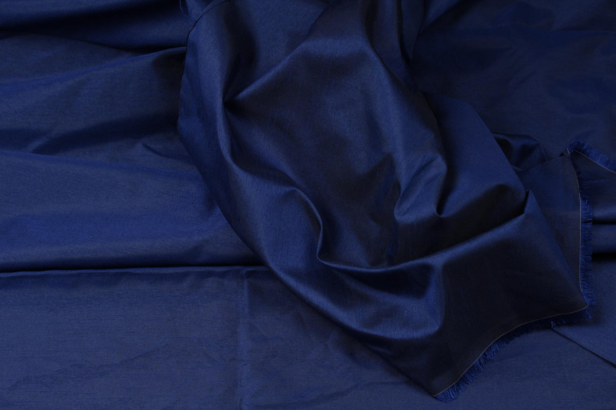 Royal blue faux dupioni fabric showing its textured woven surface and subtle slubbed appearance