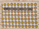 Folk lion motif on hand block printed cotton fabric shown with ruler for scale