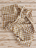 Soft mulmul cotton fabric with colourful folk lion print shown in a drape