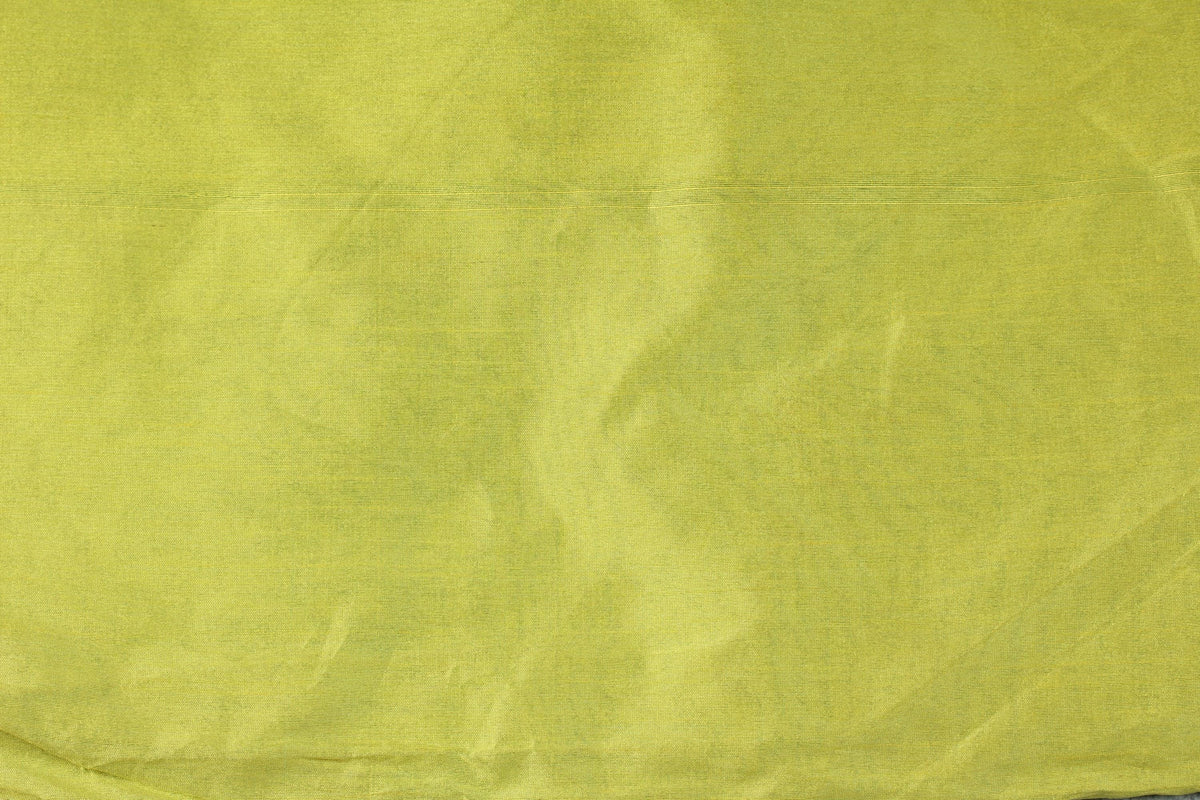 Folded chartreuse faux silk dupioni fabric in a vibrant lime yellow-green colour