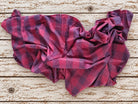 Vintage raspberry and plum plaid sari silk fabric loosely draped to show its soft flowing texture