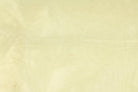 Close-up of pale vanilla cream faux dupioni fabric with a lightly textured surface and silk-like appearance.