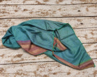 Vintage recycled pure silk saree fabric in green and blue checks, draped to show its soft flowing texture and sheen