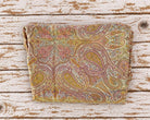 Folded vintage silk chiffon sari fabric featuring an intricate paisley and floral pattern in earthy colours