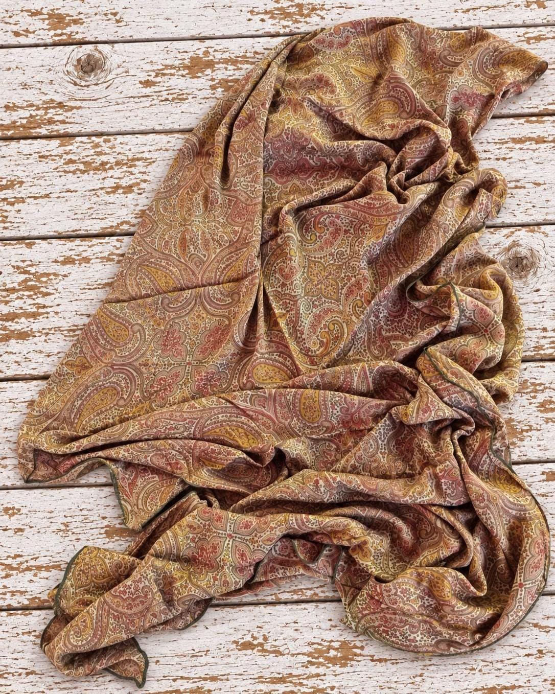 Recycled vintage Indian silk chiffon fabric with intricate paisley and floral print shown loosely draped