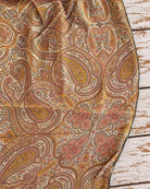 Close-up of intricate paisley and floral motifs printed on lightweight vintage silk chiffon