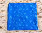 Folded vintage blue Indian sari silk fabric with a tonal floral and paisley print