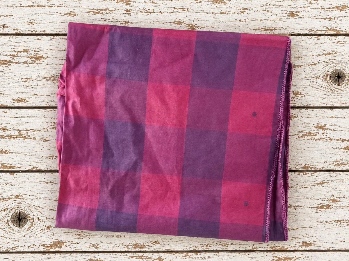 Vintage Indian sari silk in raspberry pink and plum purple oversized plaid, folded to show the full check pattern
