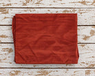 burnt orange vintage sari silk fabric piece folded to show approximate one metre size