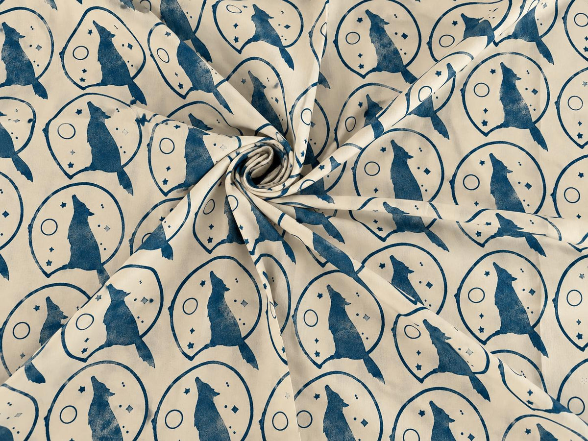 Howling wolf moon design on soft indigo and cream mulmul cotton fabric