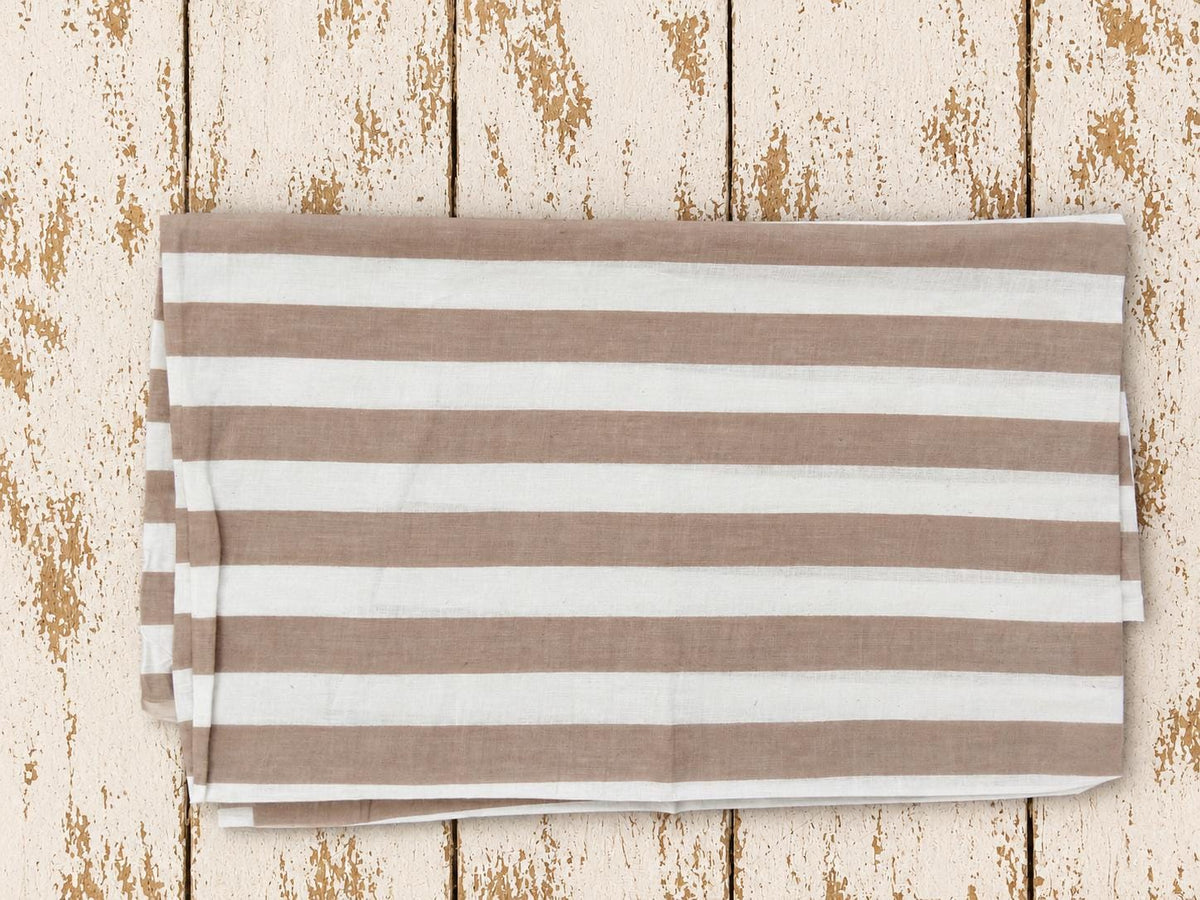 Folded taupe and white striped lightweight cotton fabric showing the stripe pattern