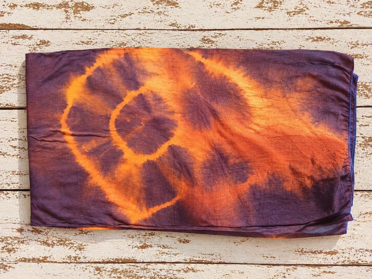 Folded vintage sari silk fabric in burnt orange and plum with stitched edges