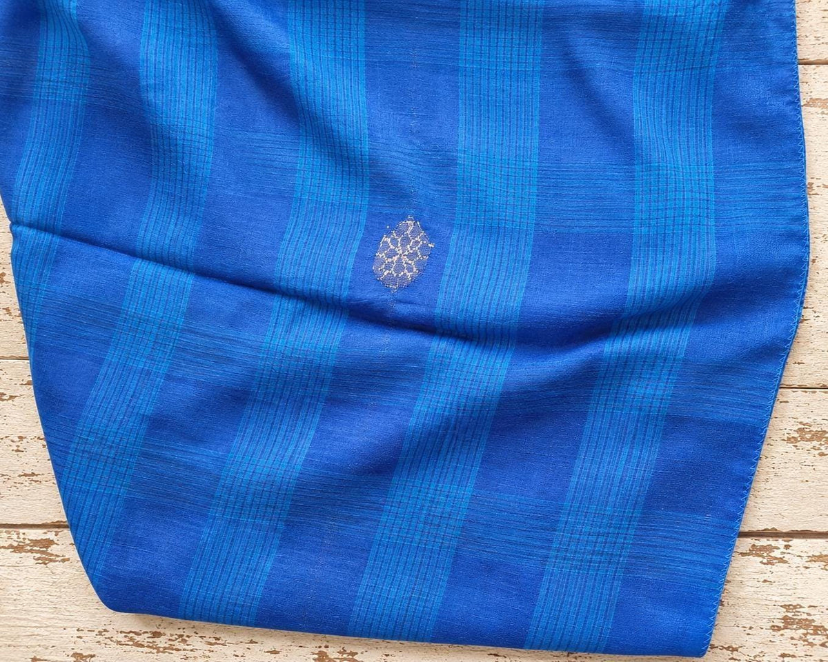 Cobalt blue vintage woven fabric with turquoise checks and a small silver motif.