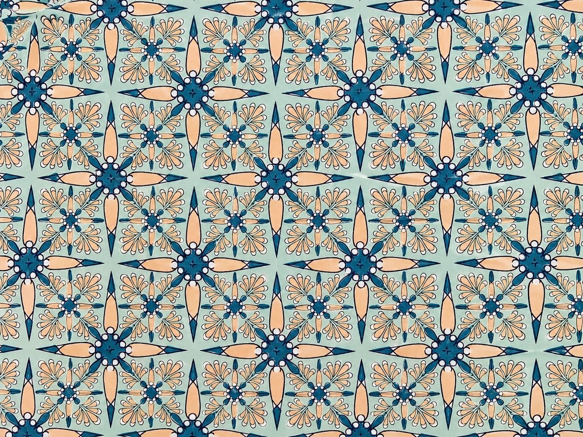 Repeating Vintage Starflower pattern in mint, teal and peach on hand block printed cotton fabric