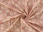 Peach Indian cotton fabric with Vintage Starburst hand block print shown in a flowing drape