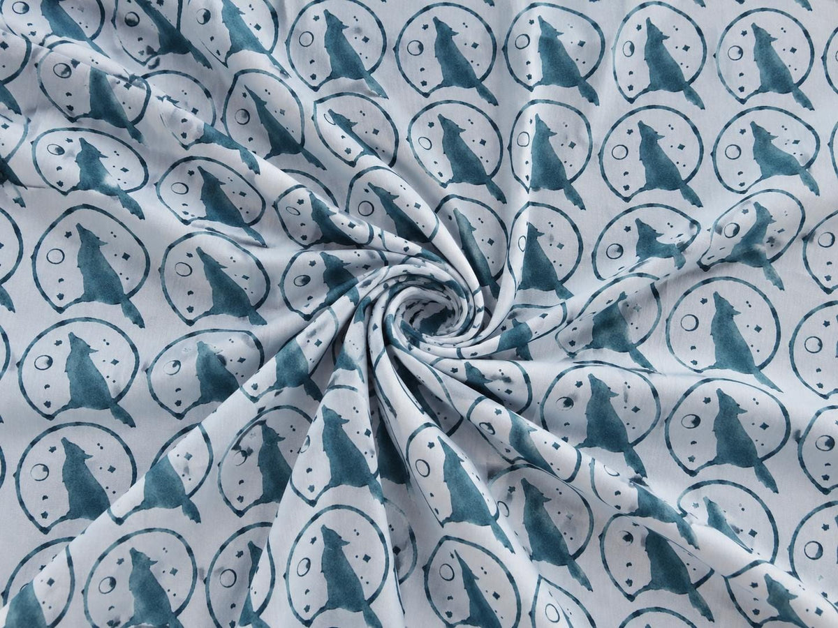 Muted dusty blue wolf and moon pattern on light blue hand block printed cotton fabric