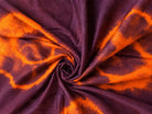 Close-up of burnt orange and plum tie-dye patterns on vintage sari silk fabric