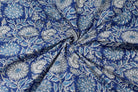 Indigo Chrysanthemum Heritage block print cotton fabric gathered to showcase drape, texture, and floral pattern detail